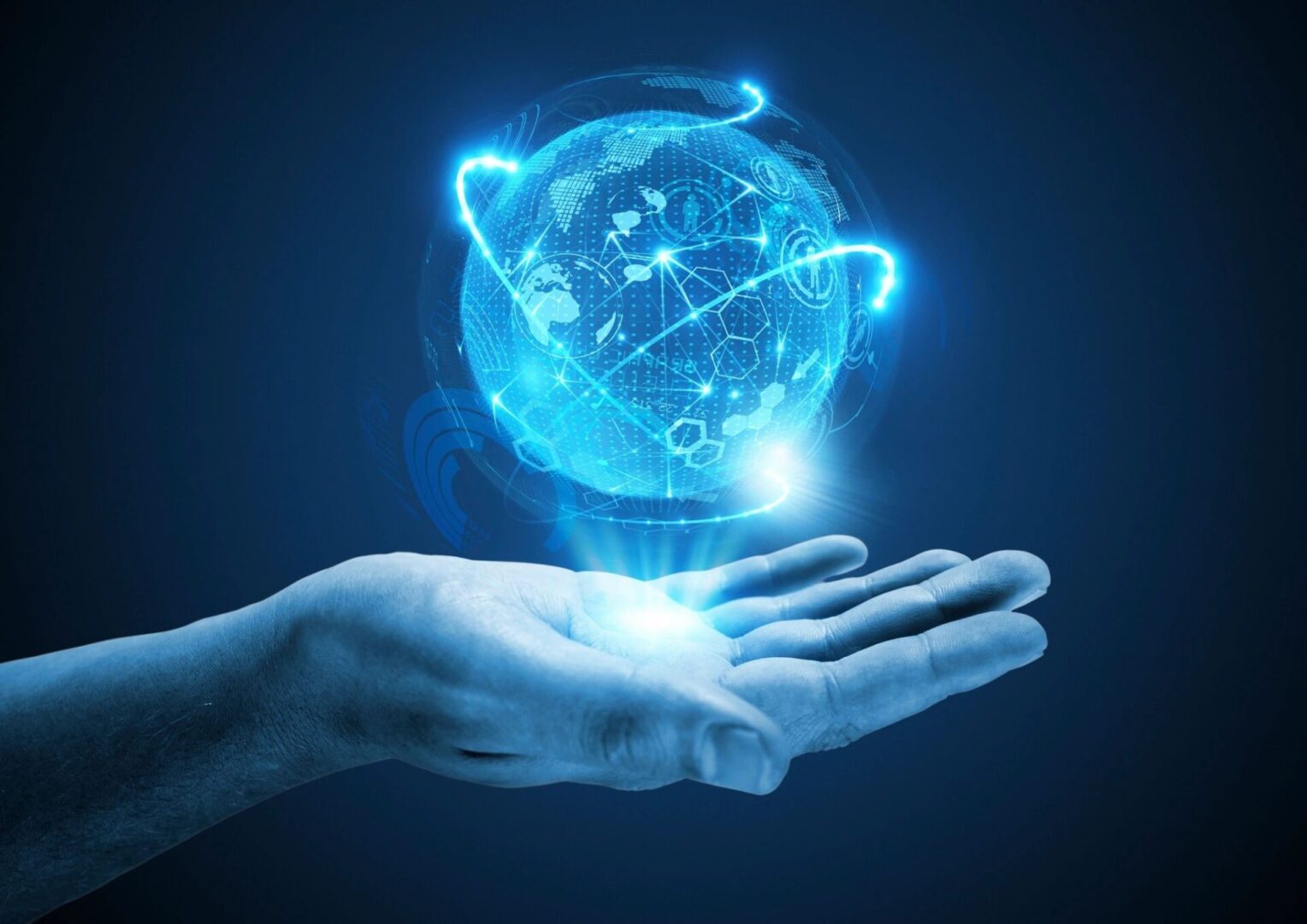 blue globe showing technology above hand